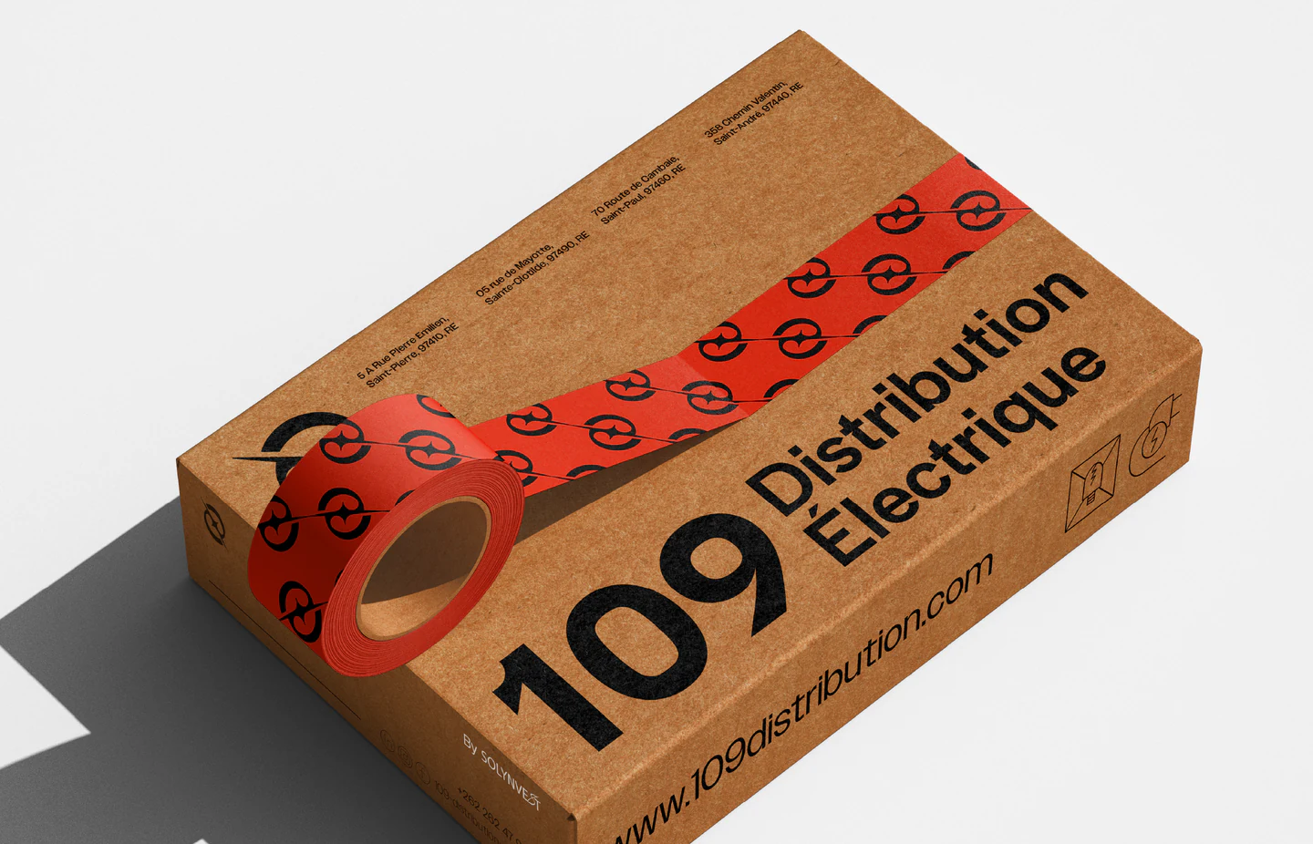 A kraft box sealed with red branded tape