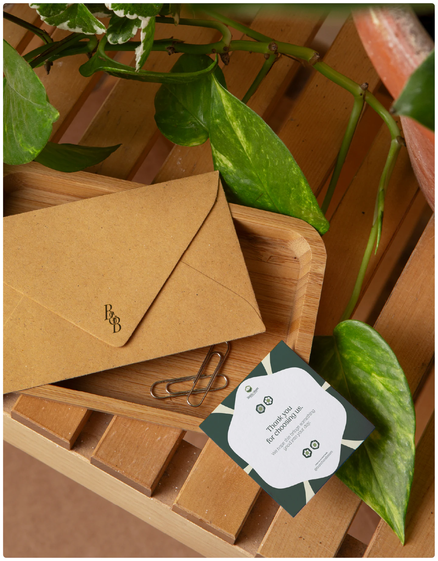 A card resting in a wooden tray