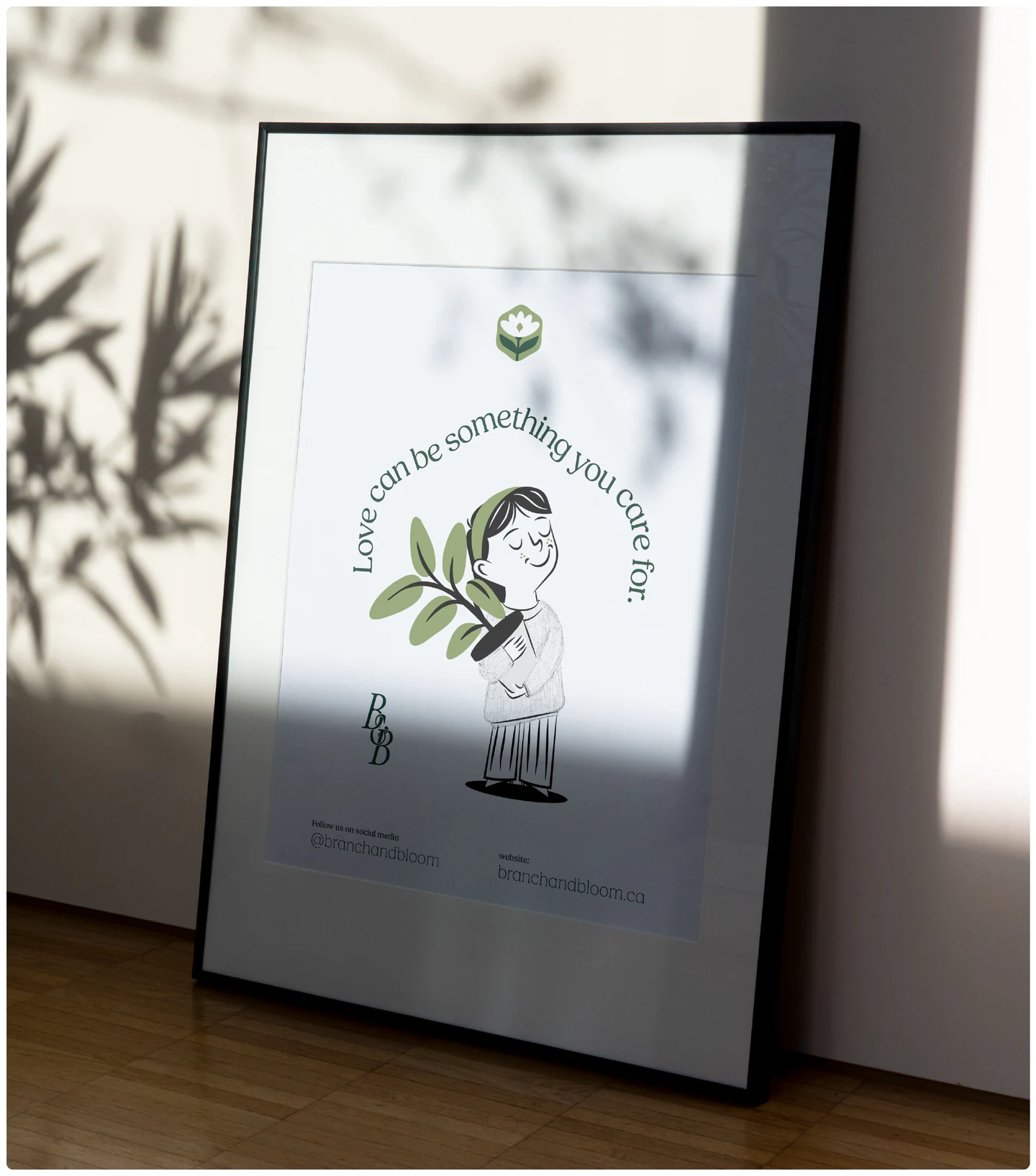 A framed illustration leaning against a wall