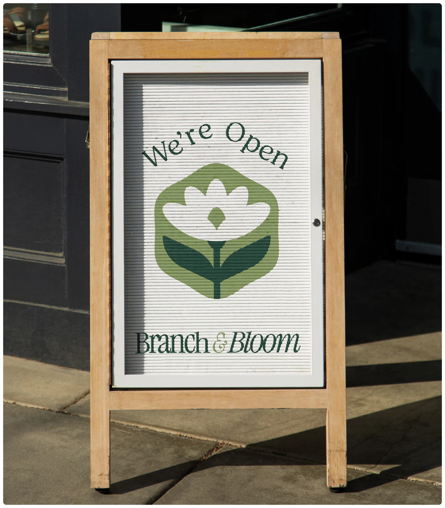 A wooden A-board: We’re open