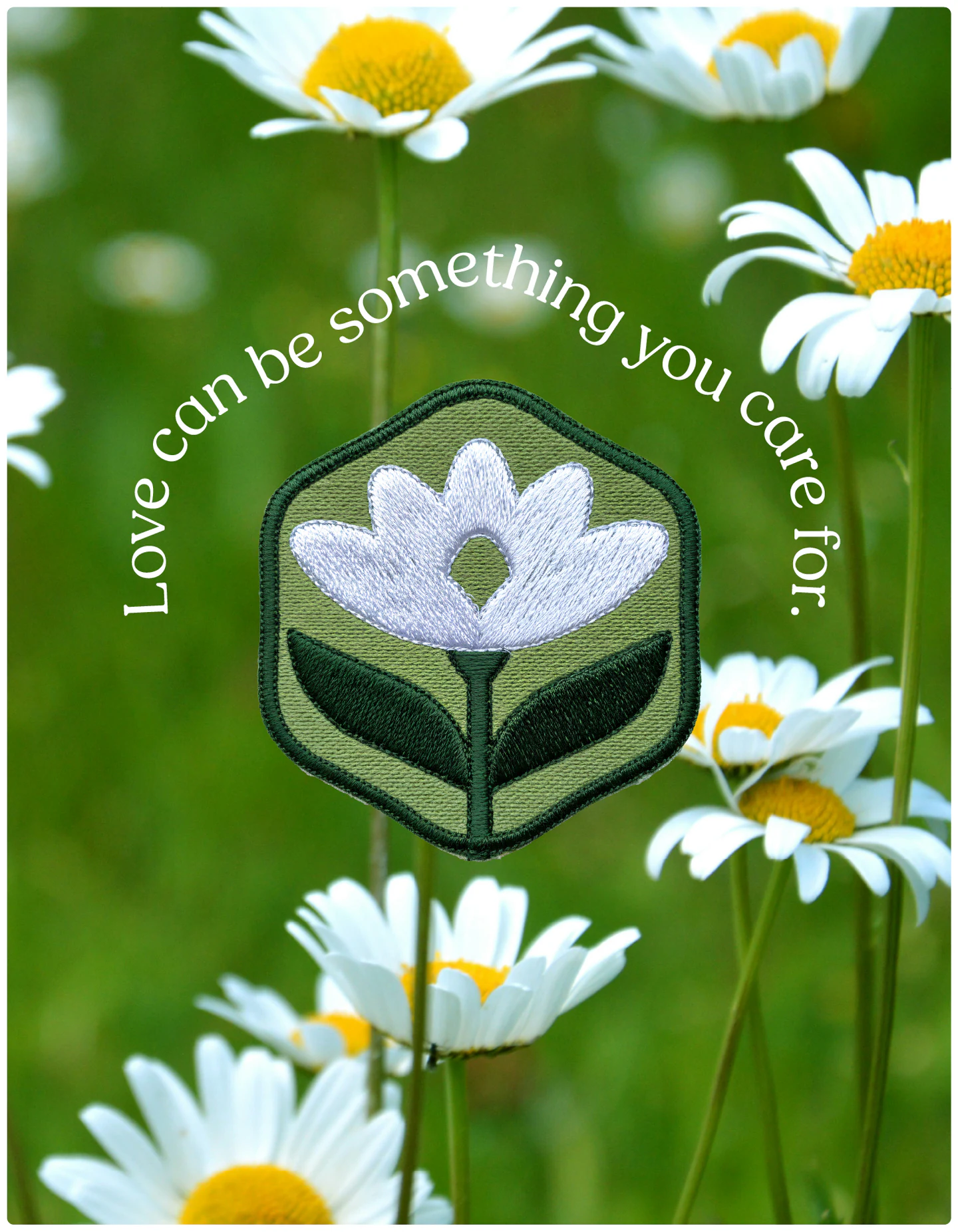 An embroidered patch among daisies