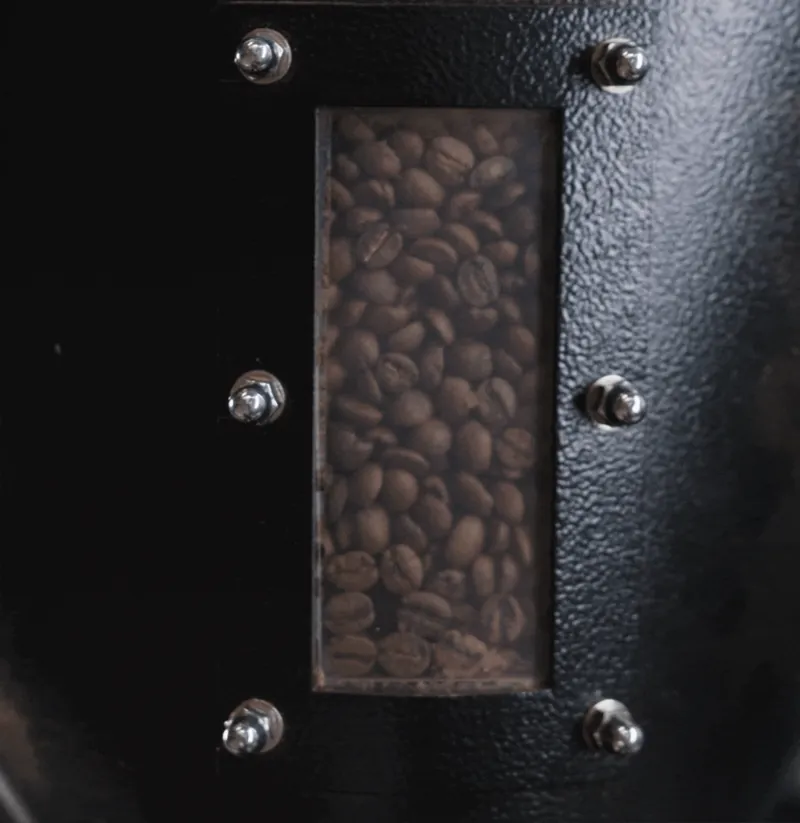 Animation: coffee beans pouring in a dark window