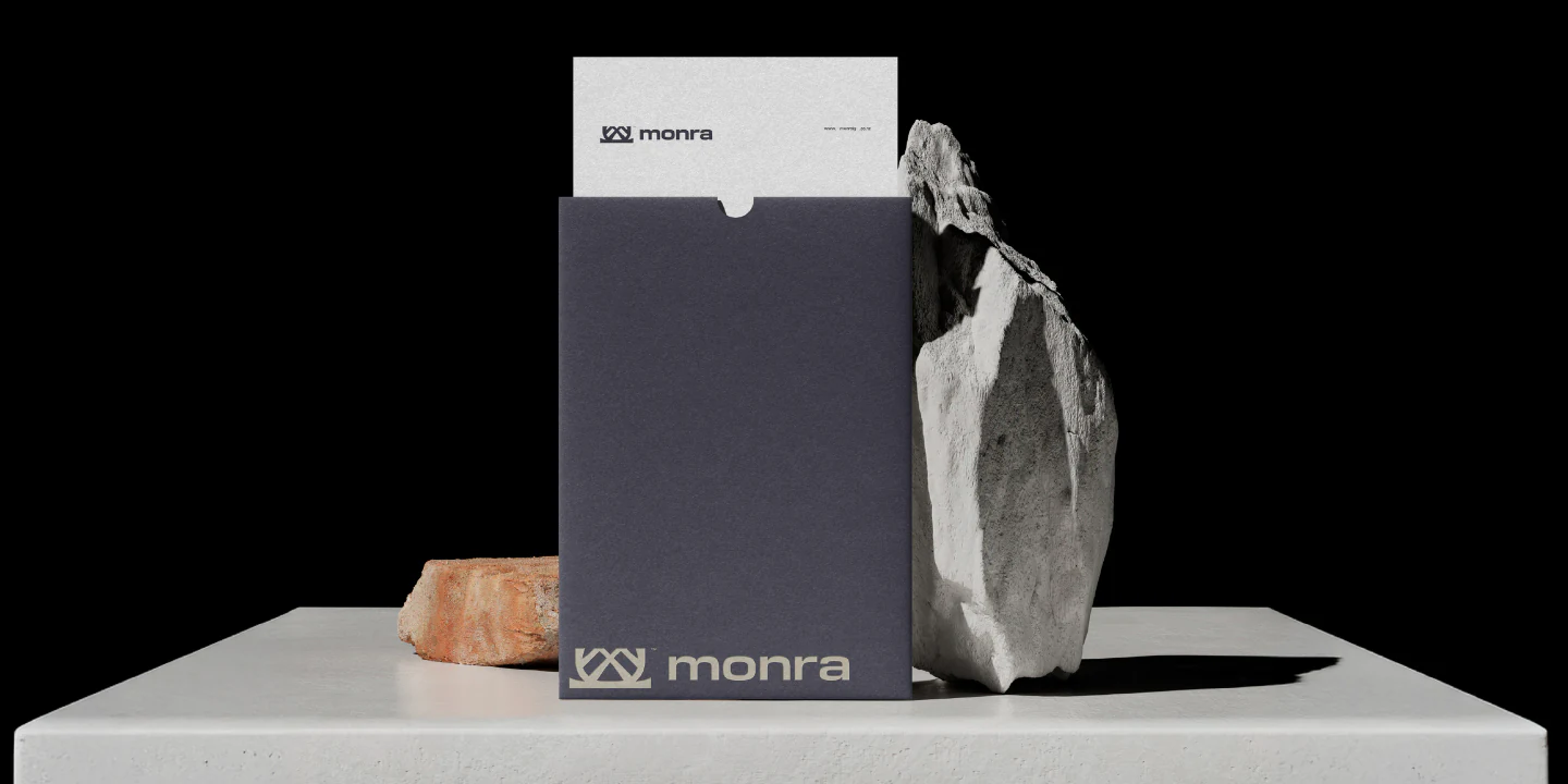 A Deep Basalt document folder beside a raw stone