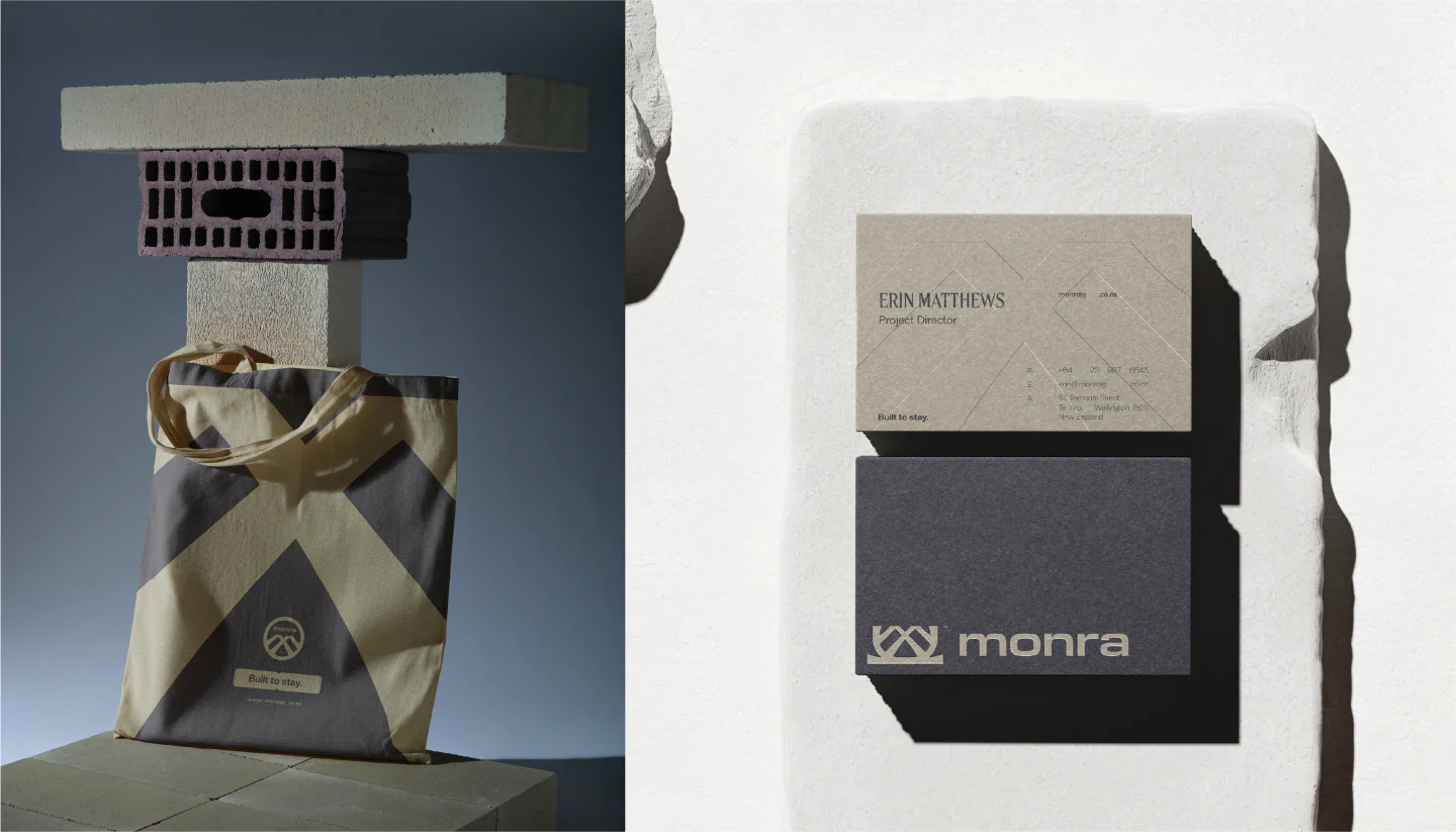 A tote bag on a concrete plinth and stacked business cards