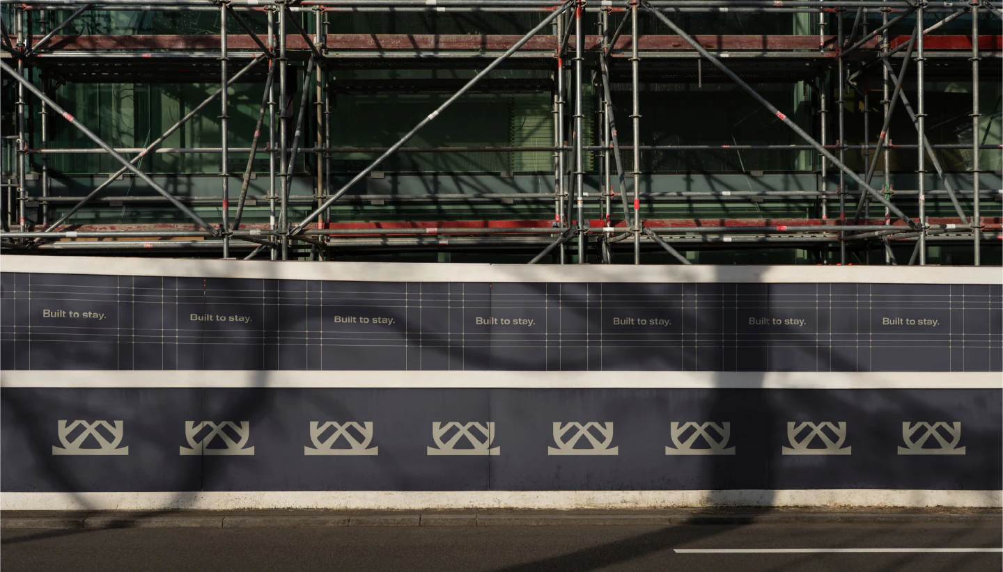 Construction hoarding repeating the Monra mark
