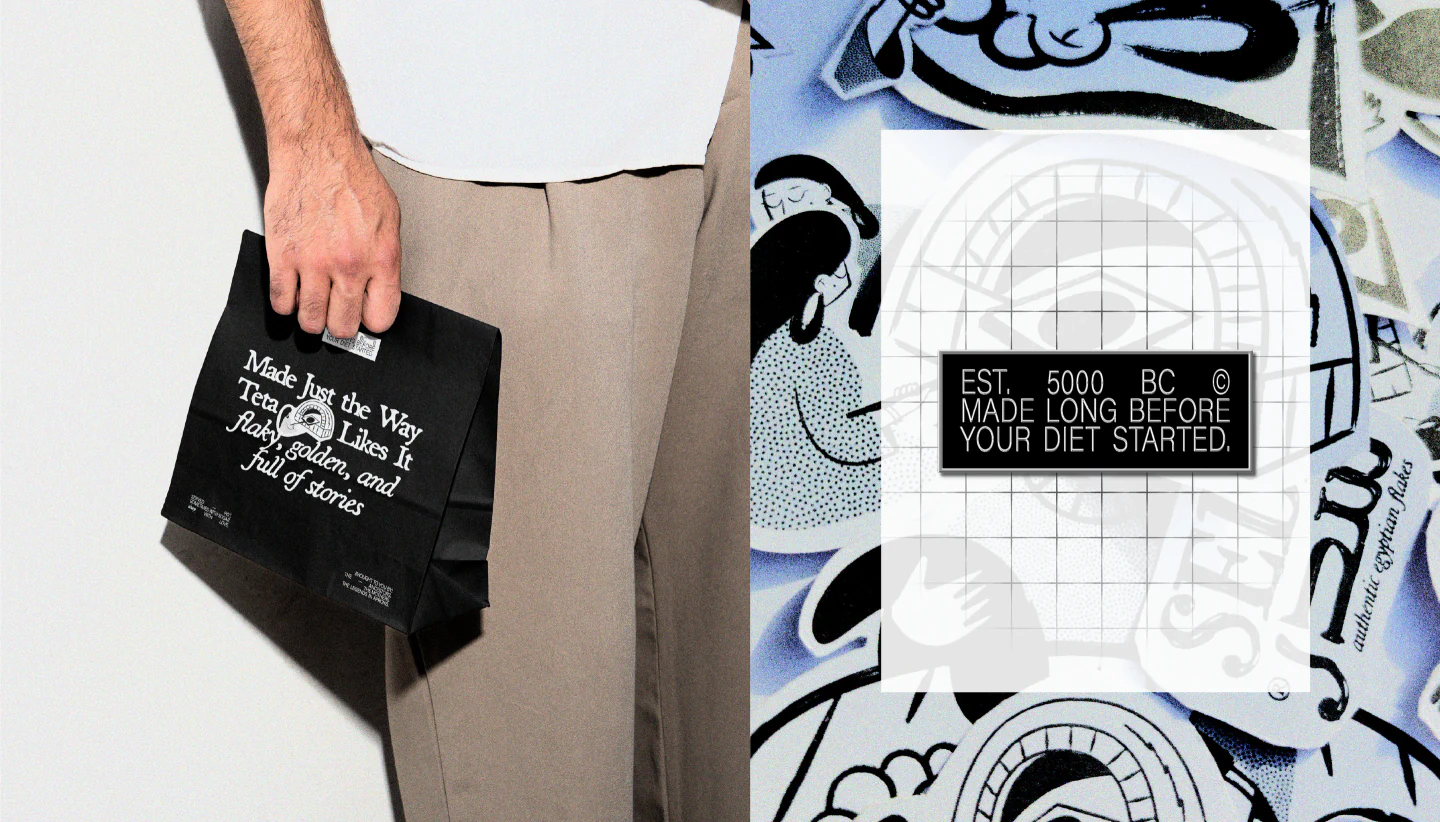 Black takeaway bag and a wall of illustrated stickers