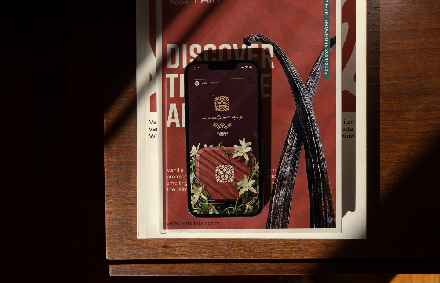 A framed phone and print on the red background